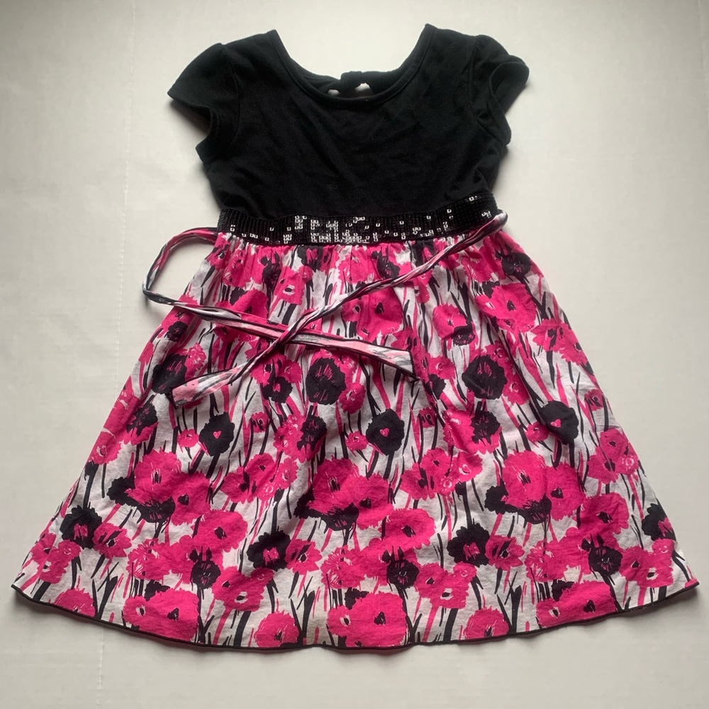 A black and white dress with pink flowers